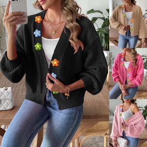 Detailed knit texture and colorful flower appliques on this short cardigan sweater