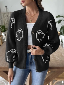 Close-up of black Halloween cardigan with white ghost patterns and marble buttons