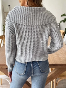 Detailed view of the thick vertical knit texture and oversized collar on grey sweater