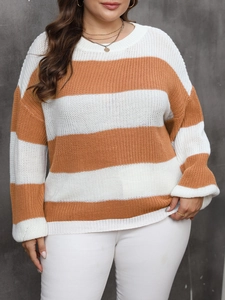 Detail of knit texture on women's plus size orange and white striped pullover sweater