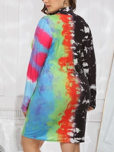 Detail view of colorful tie-dye print and bodycon fit on high neck long sleeve dress