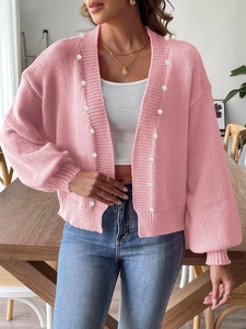 Pink knit cardigan with pearl trim and lantern sleeves for a casual loose feminine style