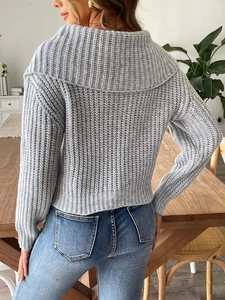 Rear view of gray knit sweater featuring a wide fold-over collar and textured stitching