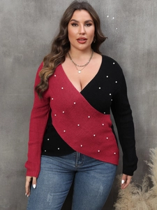 Women's plus size color-block knit sweater with deep V-neck and pearl bead accents