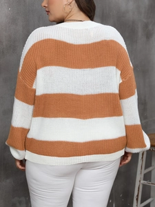 Women's oversized knit sweater featuring bold orange and white horizontal stripes