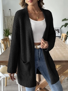 Women's black knit open front cardigan with pockets and waffle texture for autumn layering