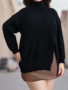 Women's black turtleneck knit sweater with loose fit, drop shoulders and side split detail