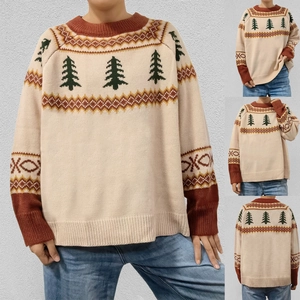 Close-up detail of beige Fair Isle knit sweater with green Christmas tree patterns
