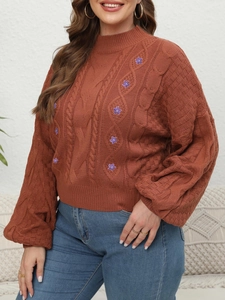 Women's turtleneck cable knit sweater in rust red with floral embroidery and lantern sleeves