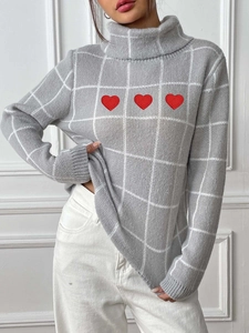 Women's turtleneck knit sweater in grey with white plaid patterns and red heart embroidery