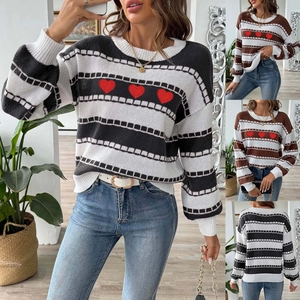Detail of striped knit sweater with lantern sleeves and red embroidered hearts on chest