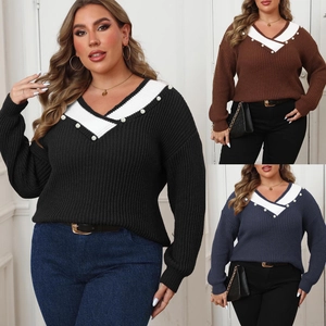Detail of V-neck knit sweater featuring pearl embellishments and contrast stitch design