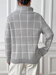 Rear view of grey high neck knit sweater featuring white grid pattern and ribbed cuffs