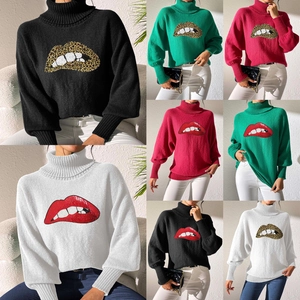 Detail of sequin lip embroidery on high neck knit sweater with leopard pattern