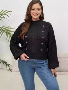 Women black cable knit sweater with purple floral appliques and lantern sleeves