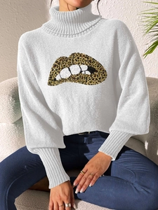 Detailed knit texture of white turtleneck sweater featuring a leopard lip print