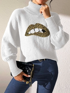 Detail of sequin leopard print lip pattern on a white turtleneck sweater and ribbed cuffs