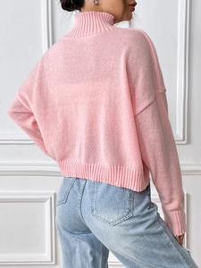 Women's pink high-neck knit sweater with drop shoulder design and ribbed cuffs in soft fabric