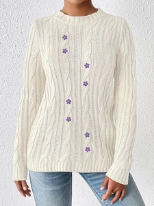 Women's white cable knit sweater with purple flower embroidery and crew neck design