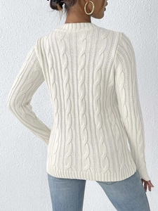 Detailed back view of off-white cable knit sweater with ribbed hem and textured pattern