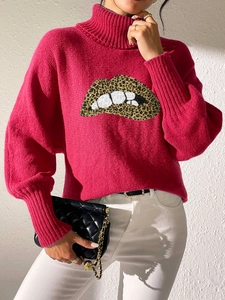 Detail of high collar knit sweater featuring sequined leopard print lip pattern