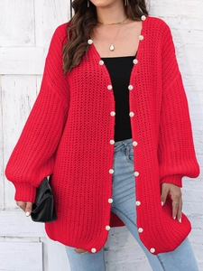 Women's chunky knit red cardigan with white pearl buttons in a loose casual style
