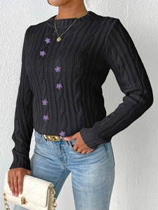 Women's black cable knit sweater with purple 3D flower embroidery and round neckline