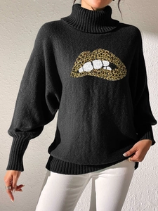 Detail of high neck black sweater featuring a textured leopard print lip sequin patch