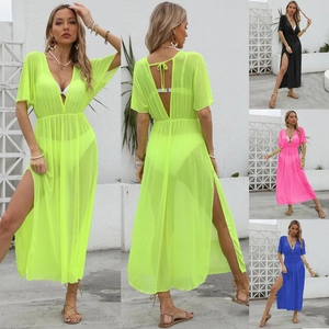 Detail of sheer mesh beach cover-up with deep V-neck, cinched waist and side slits