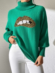 Detail of green turtleneck knit sweater with large leopard print lips sequin embroidery
