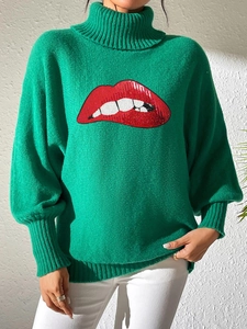 Detail of sequined red lips embroidery on a vibrant green turtleneck knitted sweater