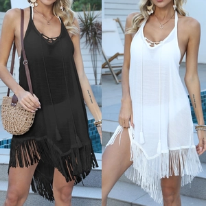 Detail view of v-neck beach coverup with criss-cross ties and long fringe trim