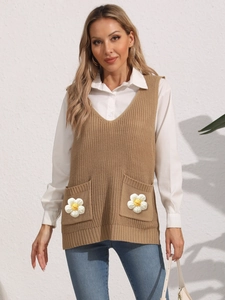 Women's V-neck khaki knit vest with white daisy pockets styled over a white shirt