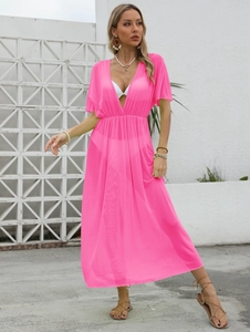 Detail of rose pink semi-transparent beach cover-up with deep V-neck and high waist pleats