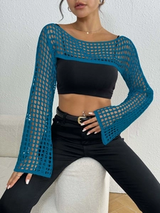 Close-up of peacock blue crochet mesh shrug featuring wide knit texture and long sleeves