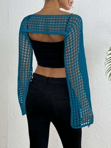 Detail of teal knit shrug showing intricate square mesh pattern and openwork texture