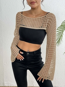 Close-up of khaki crochet shrug featuring large mesh texture and long sleeves for women