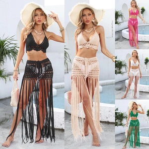 Detailed close-up showing five colors of crochet bikini sets with long fringe skirts