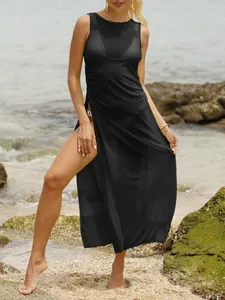 Detailed close-up of a black sleeveless sheer mesh beach cover-up with high side slit