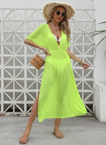 Detail of neon green sheer mesh beach cover-up with deep V-neck and high side slit