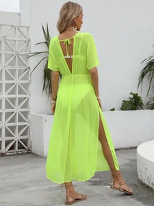 Back view of neon green sheer mesh beach cover-up with deep V-back and side slits
