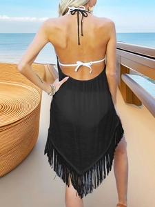 Black tassel beach cover-up with halter backless design and white tie-up straps