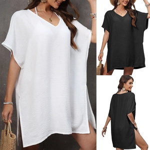 Detail of V-neck beach cover-up with textured fabric and high side slits for women