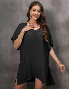 Detail of V-neck batwing sleeves on black beach cover-up with textured fabric