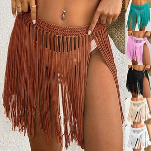 Detail of hand-crocheted beach cover-up skirt with long tassels in multiple color options