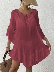Detailed crochet V-neck pattern and texture on a bohemian burgundy beach cover-up dress