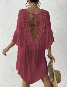 Detailed view of red crochet backless beach dress with tassels and deep V embroidery