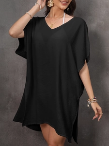 Detailed view of the V-neckline and textured black fabric on this loose summer beach cover-up