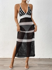 Chic black and white crochet hollow out halter maxi dress for beach resort wear