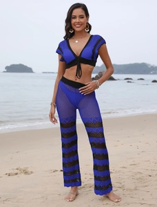 Detailed close-up of blue and black crochet beach set showing wave pattern and knit texture
